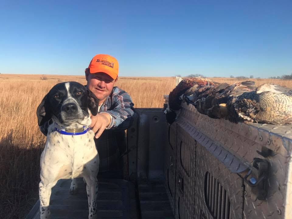 Hunter and bird dog at Bluestem Hunting Preserve